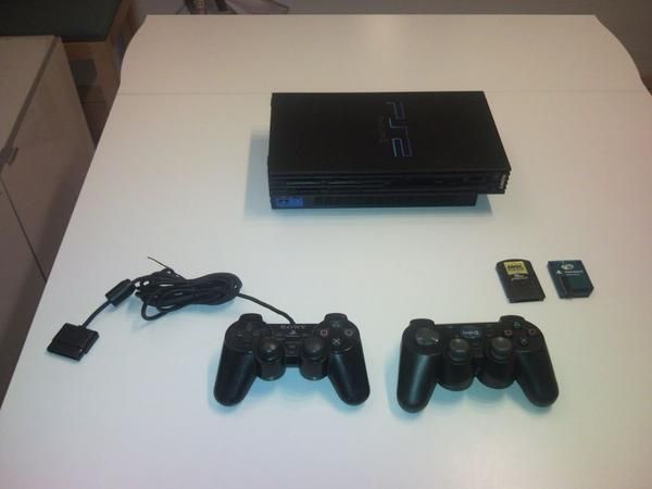 PS2 - PlayStation 2 con 10 juegos - 99 .