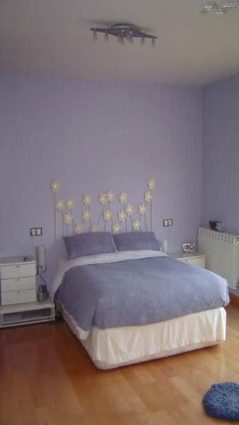 Precioso y moderno dormitorio de matrimonio, en madera lacada en blanco.