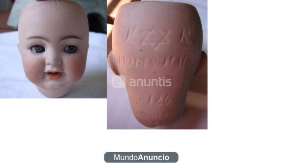 Venta de muñecos antiguos y cabezas de porcelana.