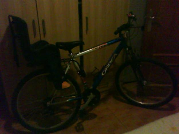 vendo bicicleta orbea con silla para niño