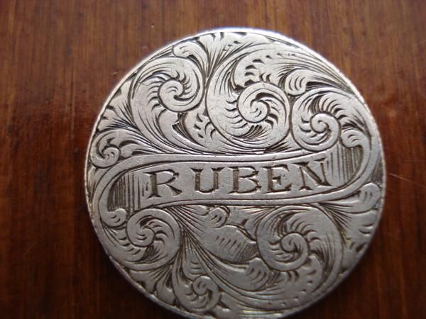 Moneda antigua con grabado Ruben