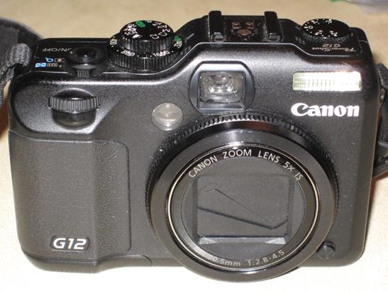 Camara G12 + funda + bateria auxiliar