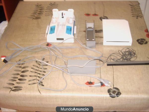 Vendo wii blanca + 5 juegos + accesorios