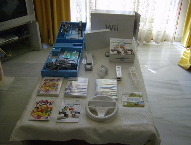 nintendo wii+4 juegos+ 1 mando con funda+1nunchako+1 volante